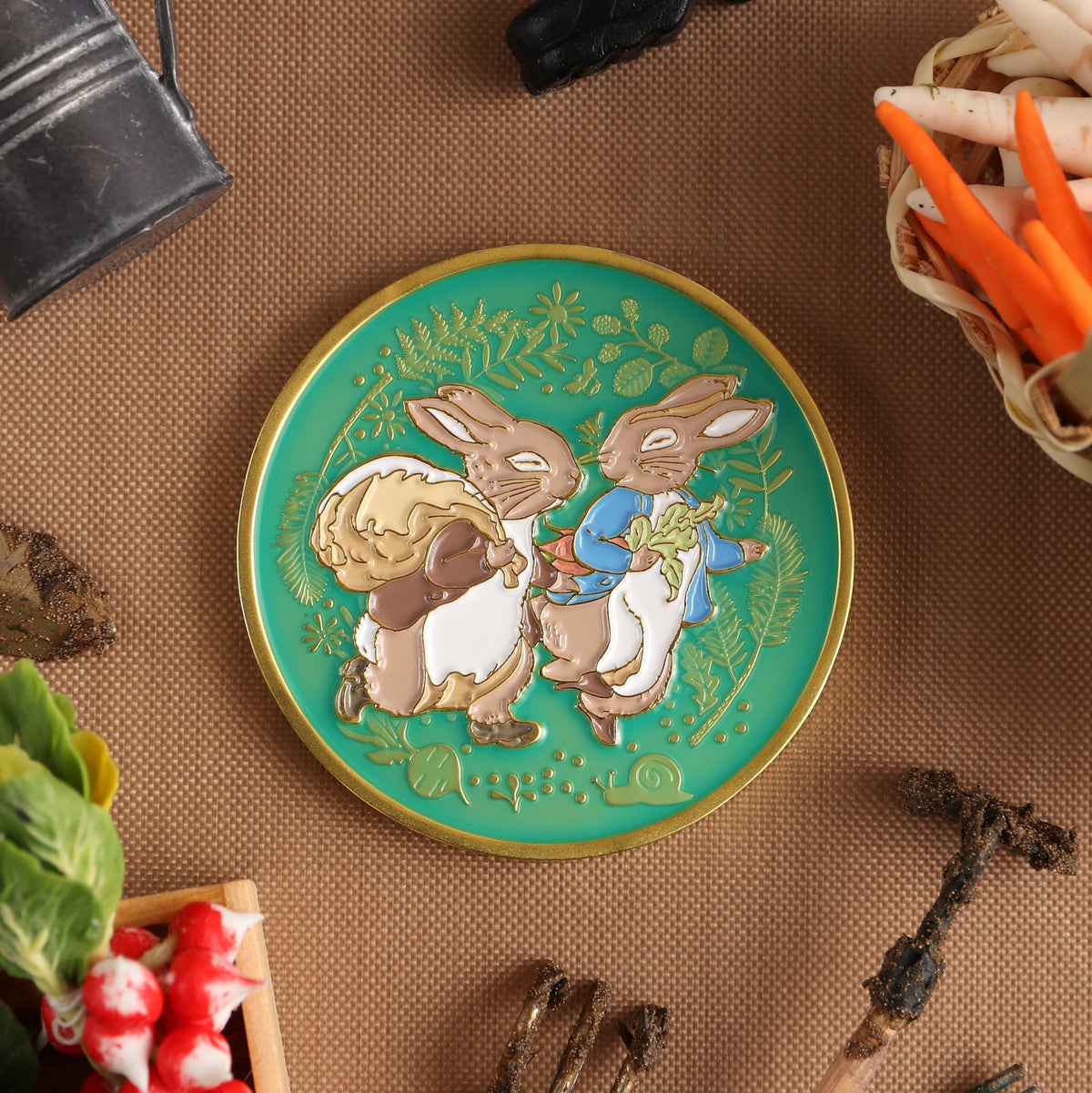 Enamel reverse of the Peter Rabbit collector's coin made by Aspinline