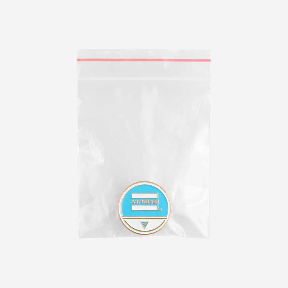 Pin badges packed in a clear pouch for travel