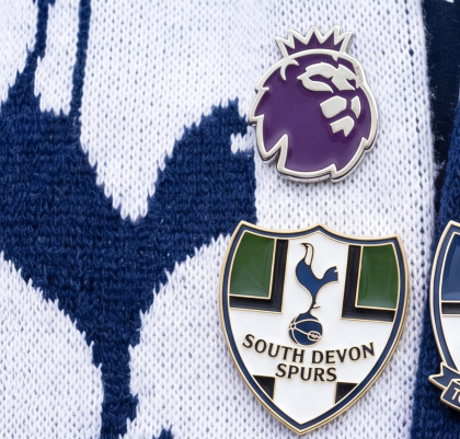 Football club pin badges worn on a scarf